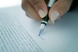 Woman signing a contract