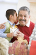 Boy Surprising Father With Christmas Present