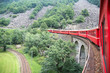 Passenger swiss train in a high mountain railroad Passenger swiss train in a high mountain railroad