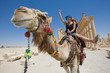 two girls are ride on camel in desert two girls are ride on camel in desert