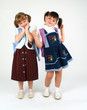 pretty school girls posing on white