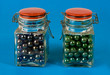Two glass jars with red lids