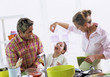 Parents with daughter (6-7) in kitchen