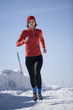 Photo: Young woman jogging in snow Young woman jogging in snow
