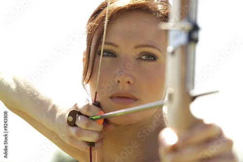 Photo: Female archer, close-up Female archer, close-up