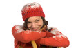 Young woman leaning on sledge, smiling, portrait