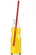Bottle of yellow liquid with red straw
