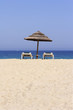 sun lounger on empty sandy beach in Corsica France