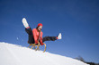 Young woman riding sledge