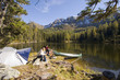 Young couple camping at lake