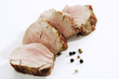 Roasted pork filet, slices, spice grains, close-up