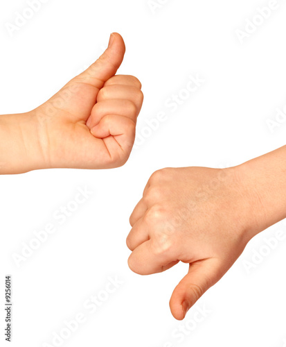 Photo: Two hands with thumbs up and down on white background Two hands with thumbs up and down on white background