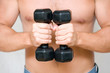 young man with black dumbbells