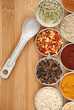 variety of spices on bamboo cutting board