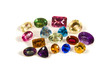 a group of large faceted gemstones on a white background