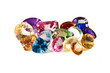 a group of large faceted gemstones on a white background