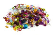 A large grouping of faceted gemstones on a white background