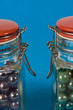 Two glass jars with red lids