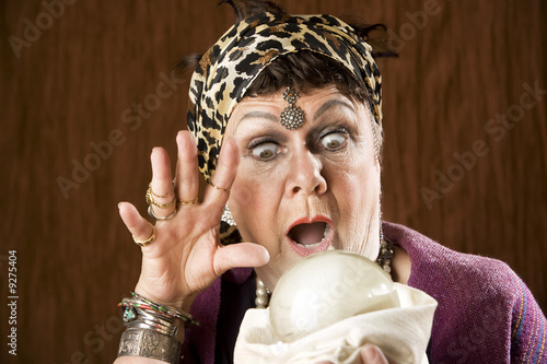 Female gypsy fortune teller with a crystal ball Female gypsy fortune teller with a crystal ball
