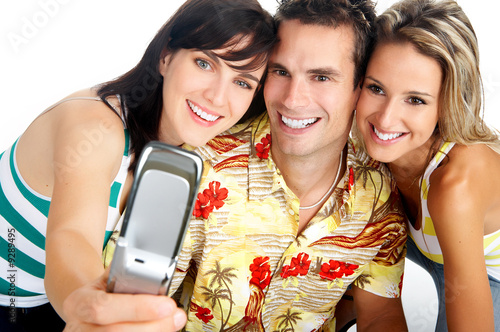 Photo: Young happy people with a cellphone Young happy people with a cellphone