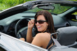 Beautiful Brunette Young Woman Driving A Sports Car Beautiful Brunette Young Woman Driving A Sports Car