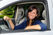 Beautiful Young Mother At The Wheel Of Her Sport Utility Vehicle