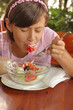 A portrait of a young girl eating salad A portrait of a young girl eating salad