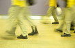 A group of manual worker walking by in a building, China. A group of manual worker walking by in a building, China.