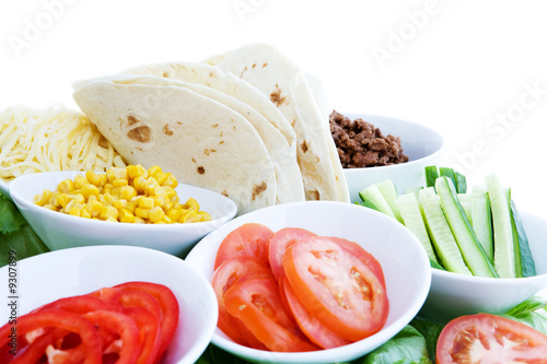 A layout of taco ingredients isolated on white