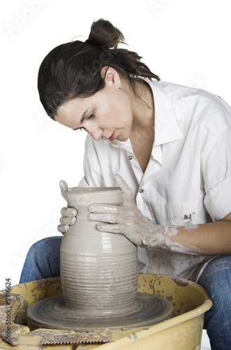 Photo: Picture of a potter works a potter's wheel Picture of a potter works a potter's wheel