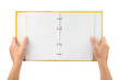 Opened notepad in hands isolated on white background