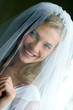 Portrait of beautiful bride in traditional white wedding dress