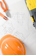 helmet, blueprints, toolbox, pliers and highlighter, concept