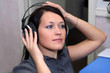 A young woman is listening to the music