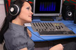A young woman is listening to radio broadcasting