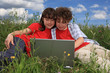 Kids using laptop outdoor