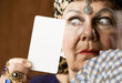 Gypsy fortune teller hiolding a blank tarot card Gypsy fortune teller hiolding a blank tarot card