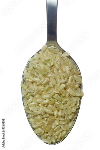Photo: Spoonful of short grain rice isolated on white background.. Spoonful of short grain rice isolated on white background..