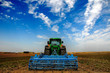 Photo: The Tractor - modern farm equipment in field The Tractor - modern farm equipment in field