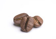 Close up of three coffee beans on white background