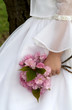flower girl holding pink flowers in hand