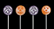 Four halloween suckers isolated on a black background
