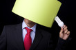 businessman holding a lamp (it's not his idea)