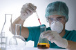 Scientist taking a probe in a labor scene with testtubes