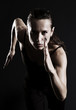 woman running over dark background