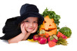 little girl in the witch costume with halloween harvest