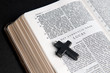 Photo: Closeup of Dutch Bible with cross, on black background. Closeup of Dutch Bible with cross, on black background.