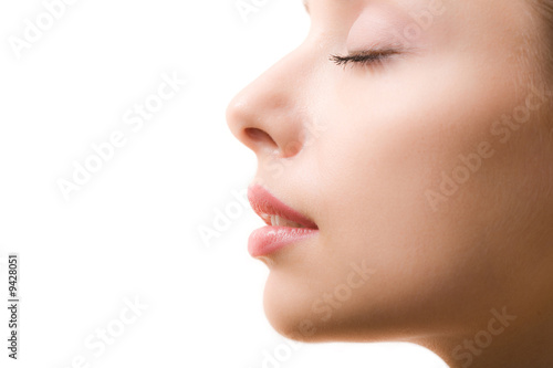 Photo: Profile of feminine face with closed eyes and make-up Profile of feminine face with closed eyes and make-up