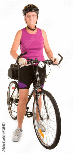 Photo: Fit Senior Woman Riding a Bicycle Fit Senior Woman Riding a Bicycle