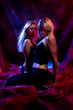 couple of blond girls dancing in the dark